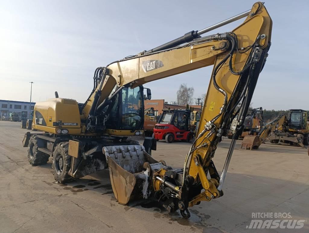 CAT M 313 D Kolesové rýpadlá