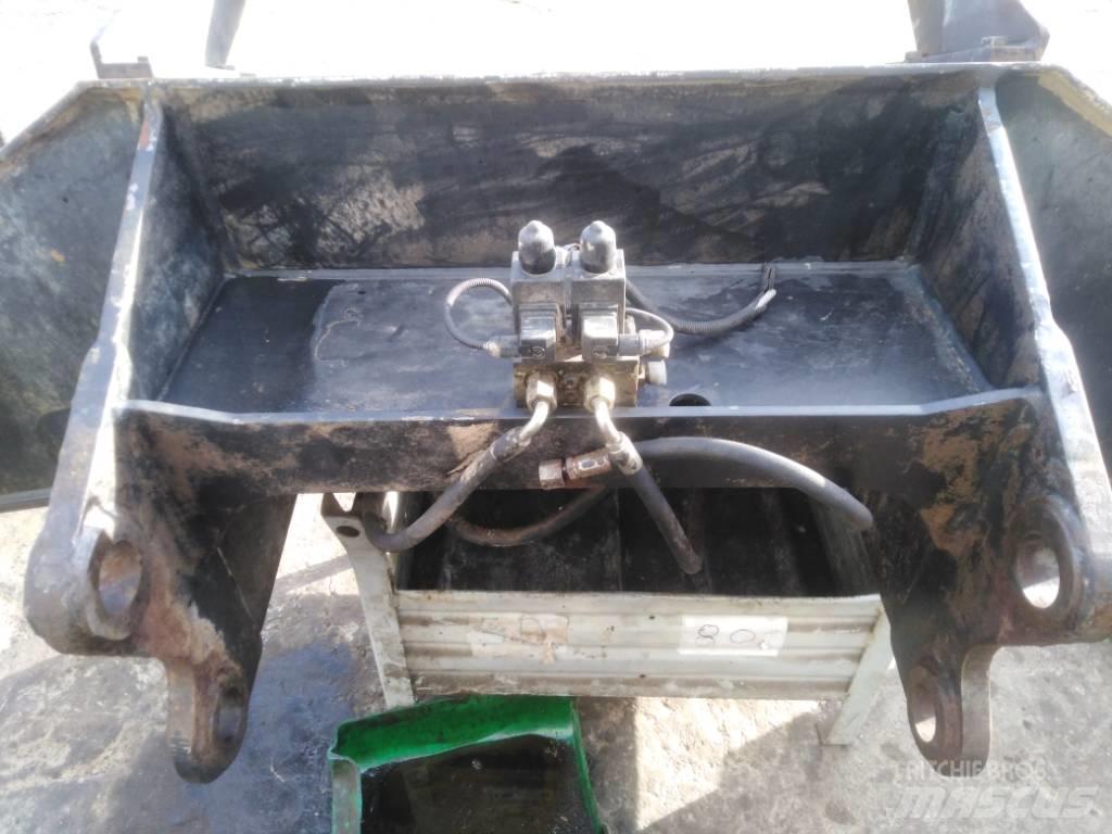 CAT M 318 Podvozky a zavesenie kolies
