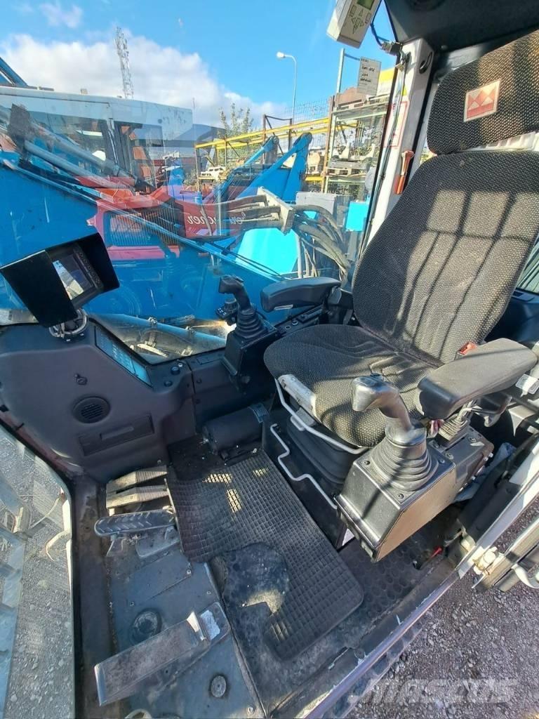 Fuchs MHL 320 Stroje pre manipuláciu s odpadom