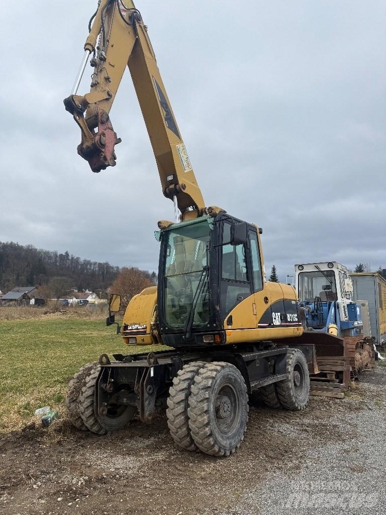 CAT M 313 C Kolesové rýpadlá