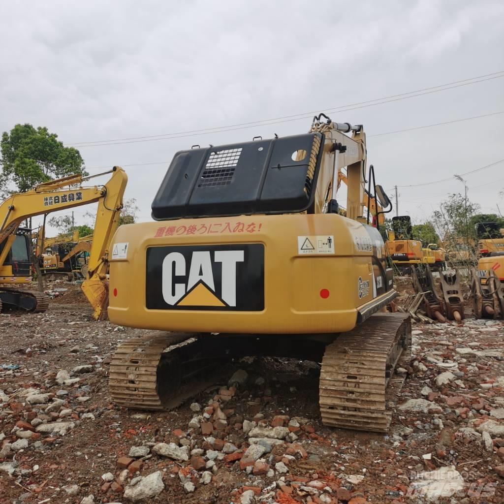 CAT 323DL Pásové rýpadlá