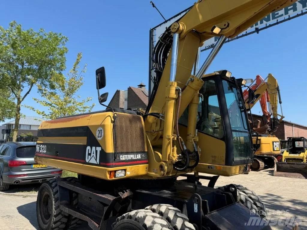 CAT M320 2001 Kolesové rýpadlá