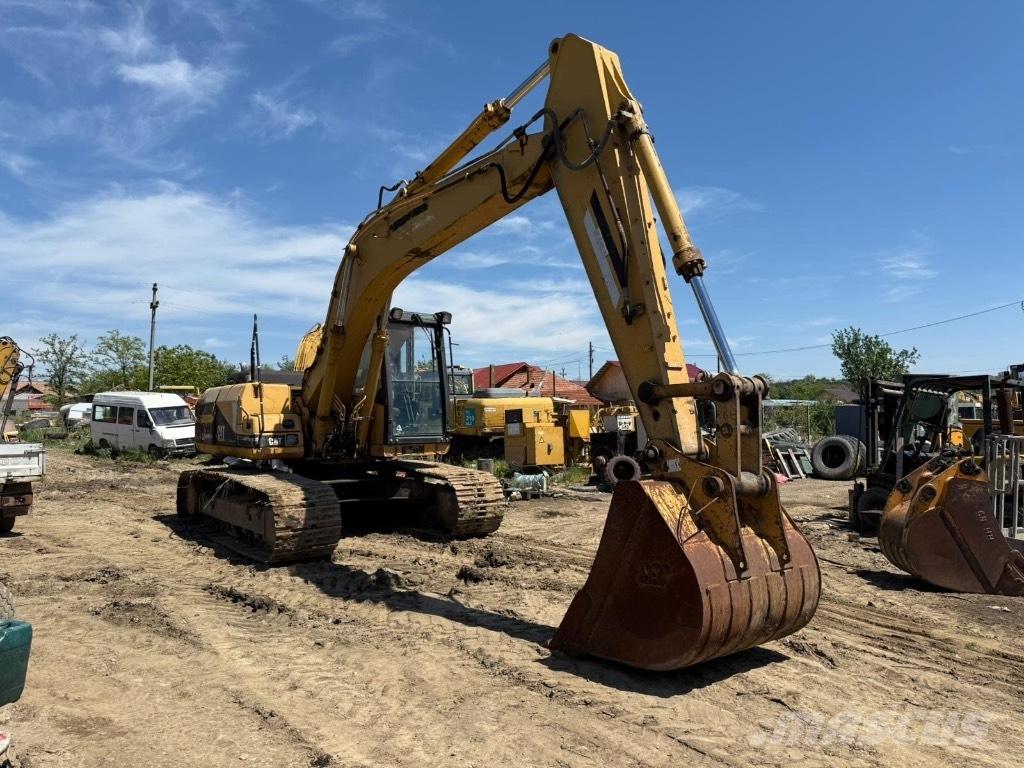 CAT 318 Výložníky a lyžice
