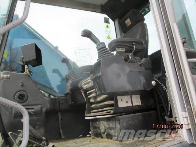 Fuchs MHL 320 Stroje pre manipuláciu s odpadom