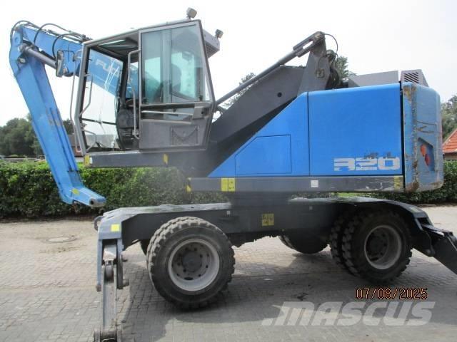 Fuchs MHL 320 Stroje pre manipuláciu s odpadom