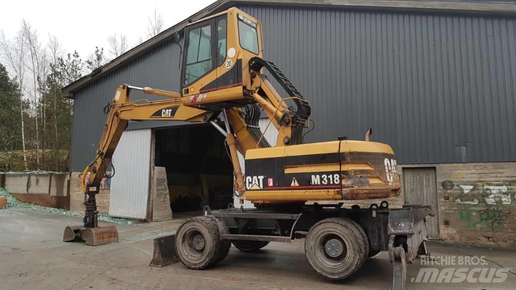 CAT M 318 Stroje pre manipuláciu s odpadom