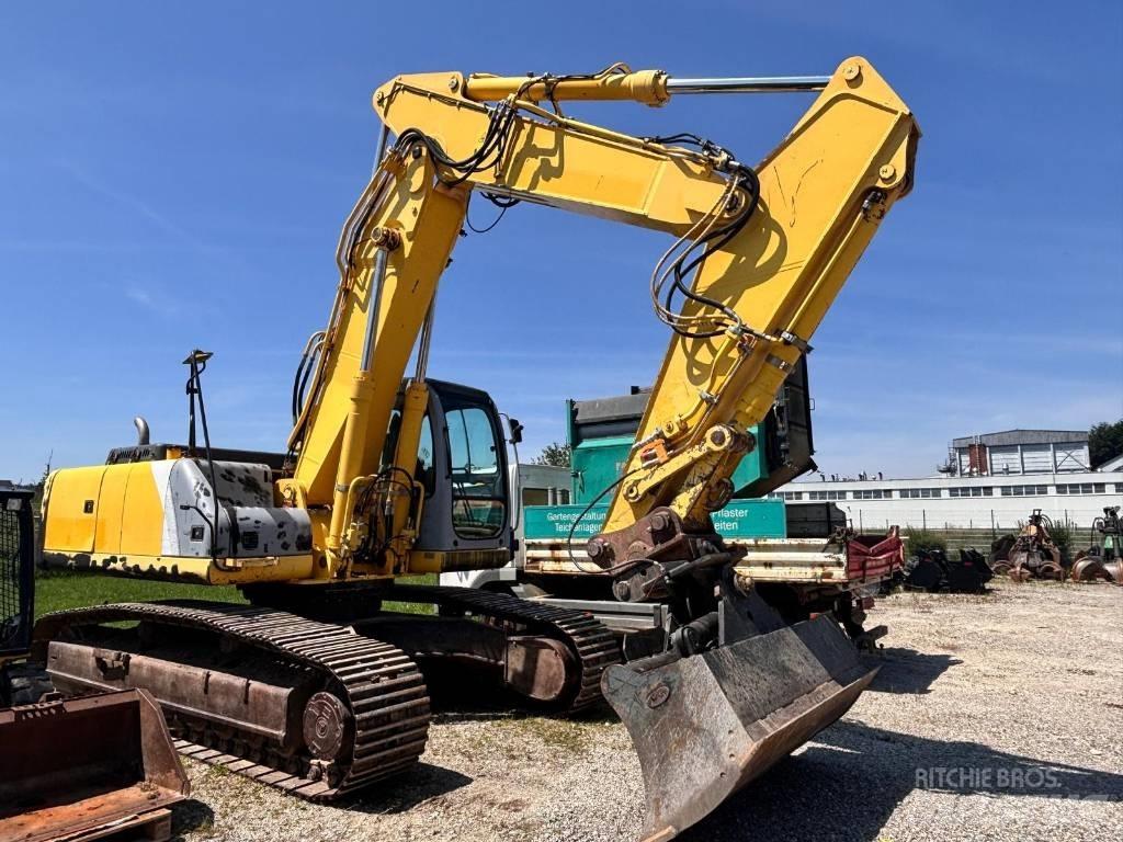 New Holland E 305 Pásové rýpadlá