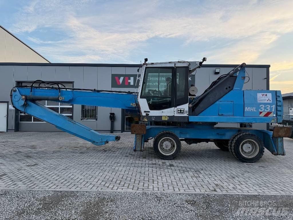 Fuchs MHL 331 Stroje pre manipuláciu s odpadom
