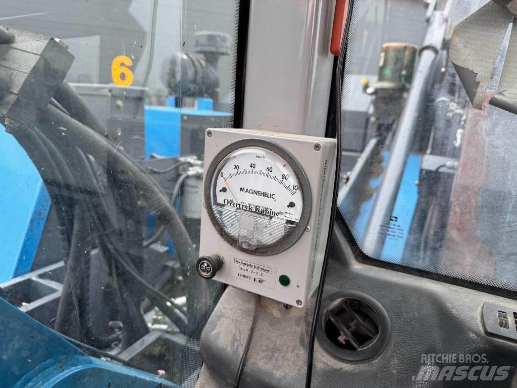 Fuchs MHL 320 Stroje pre manipuláciu s odpadom