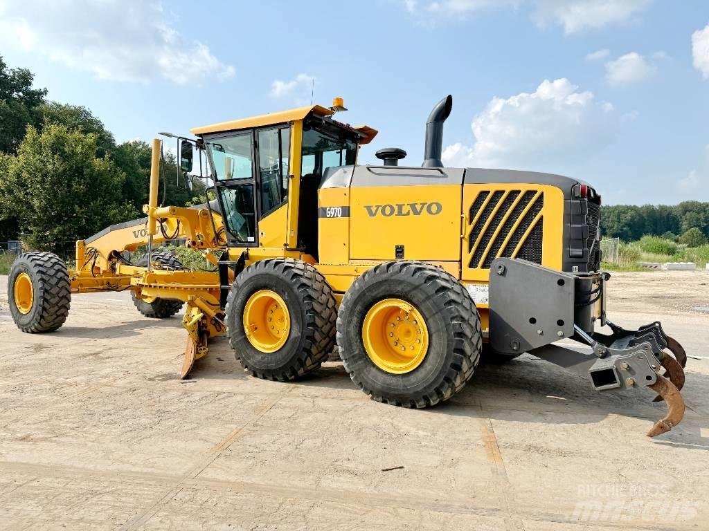 Volvo G970 + RIPPER Grejdery
