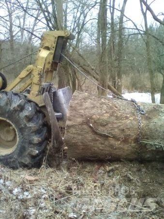 CAT 515 Skidder Šmykom riadené nakladače