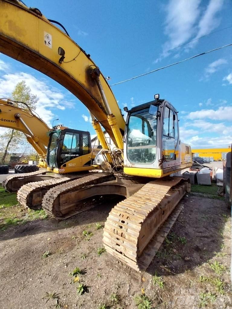 New Holland E 305 Pásové rýpadlá