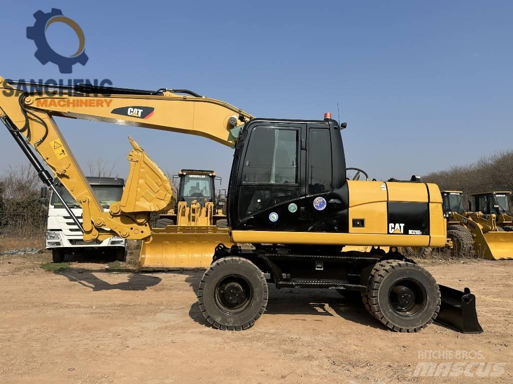 CAT M 320 D2 Kolesové rýpadlá