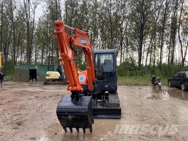 Doosan DH 140 Kolesové rýpadlá