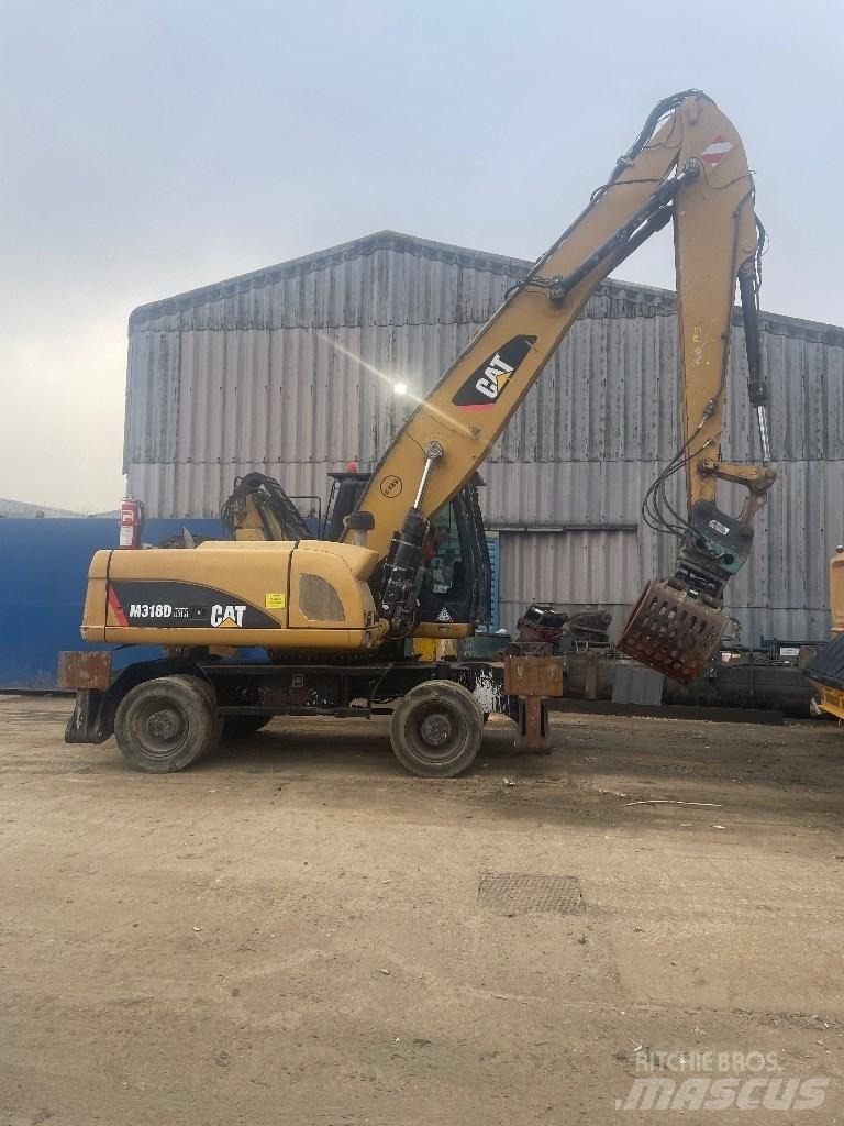 CAT 318 dmh Manipulácia s materiálom - ostatné