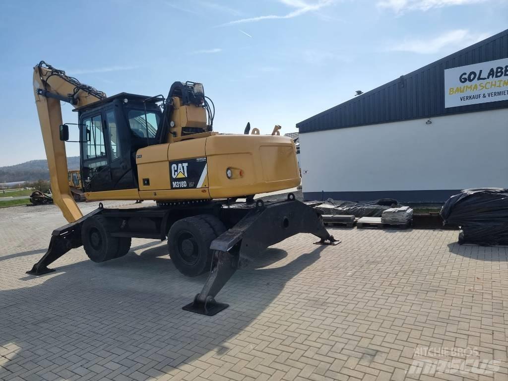 CAT 318D Stroje pre manipuláciu s odpadom