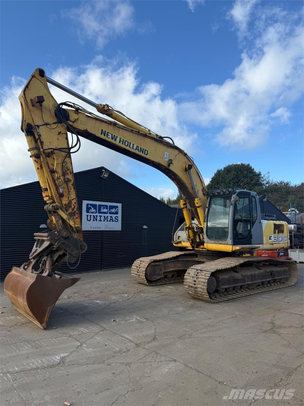 New Holland E305 Pásové rýpadlá