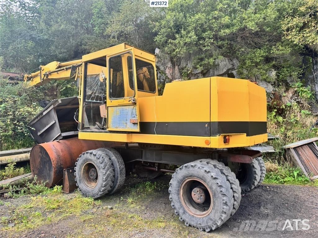 CAT 212B Kolesové rýpadlá