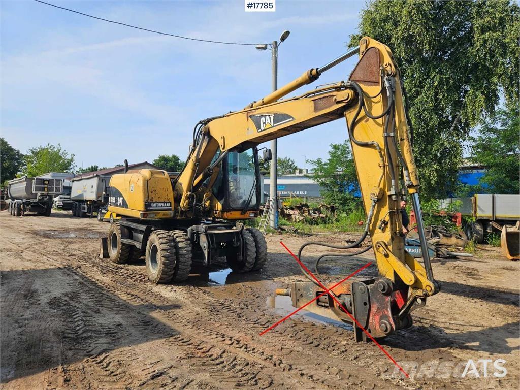 CAT M313 C Kolesové rýpadlá
