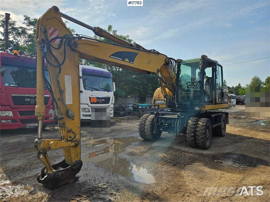 CAT M315C Kolesové rýpadlá