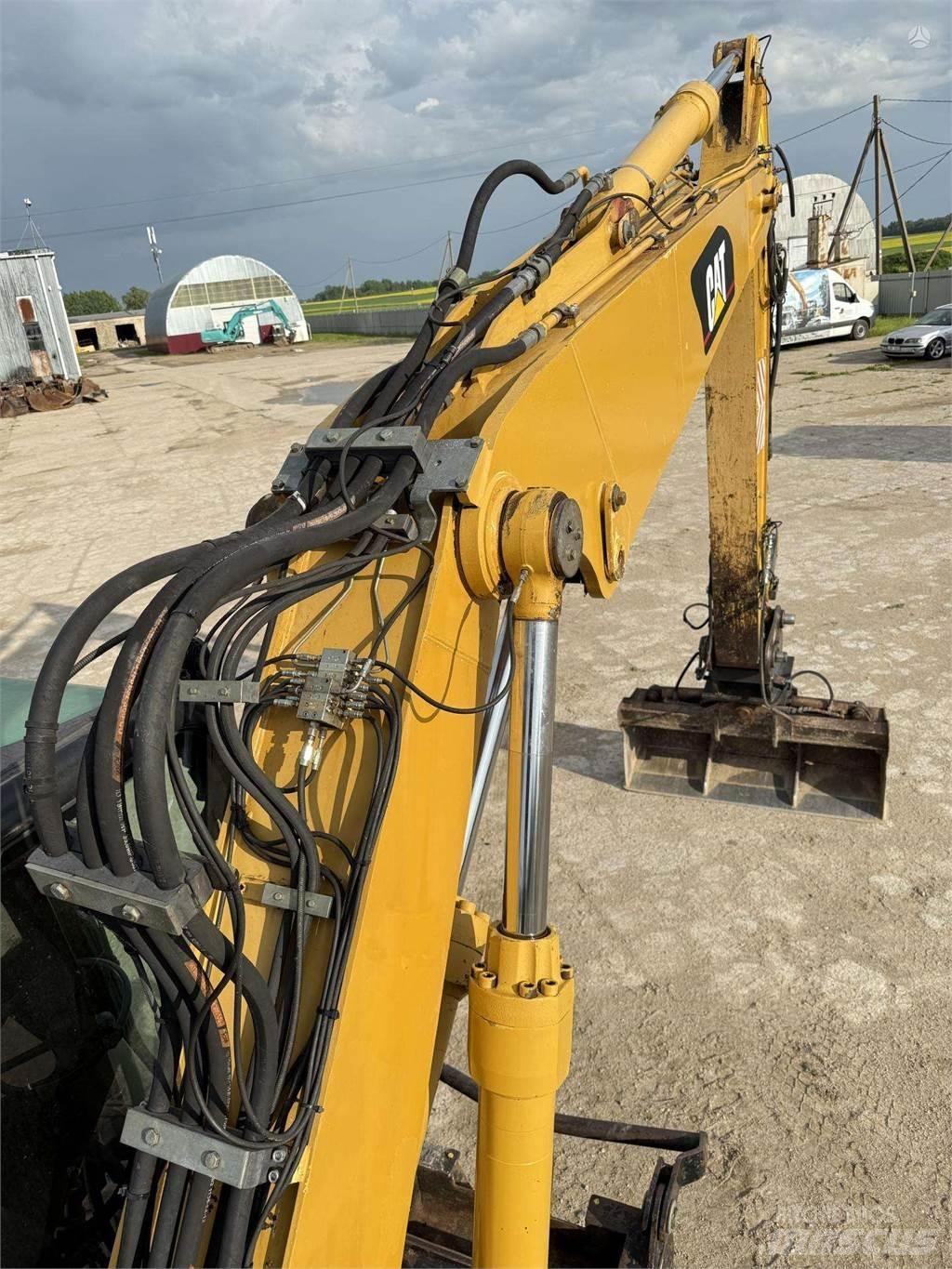 CAT M315C Kolesové rýpadlá