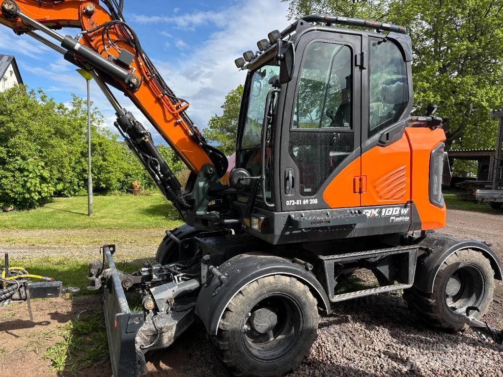 Develon DX 100 W-7 Kolesové rýpadlá