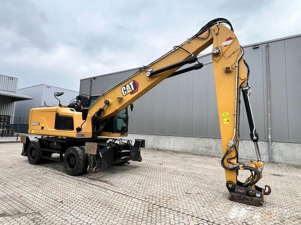CAT MH3024-06C Stroje pre manipuláciu s odpadom