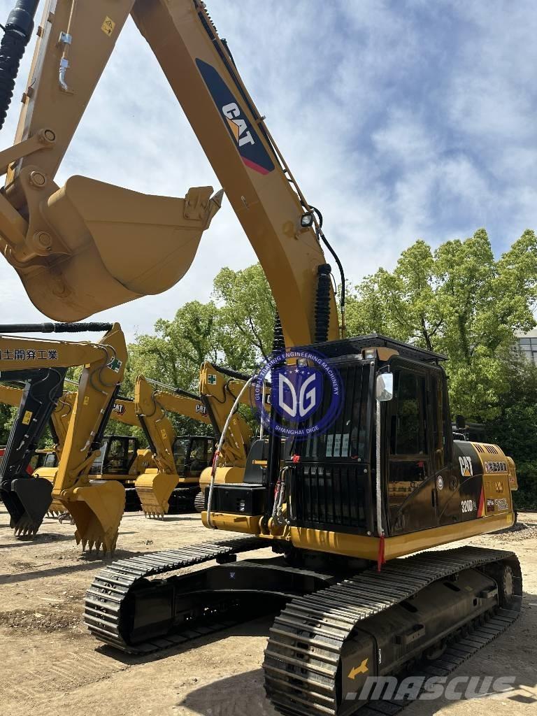 CAT CAT323 Pásové rýpadlá