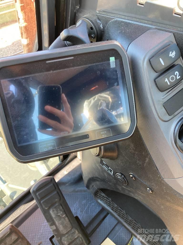 Develon DX 100 W-7 Kolesové rýpadlá