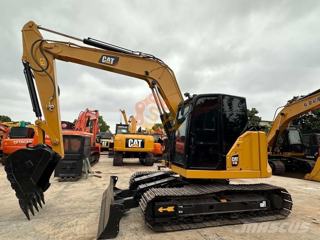 CAT 310 Pásové rýpadlá
