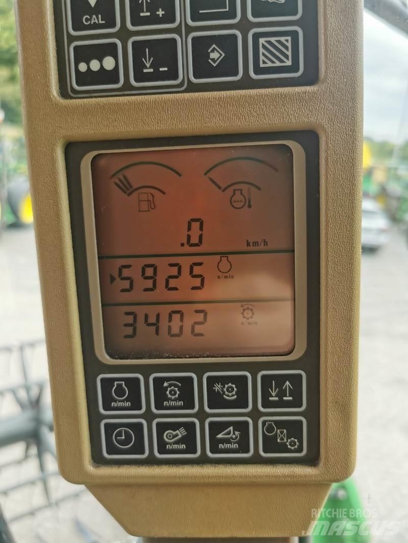 John Deere T560 Kombinované zberacie stroje