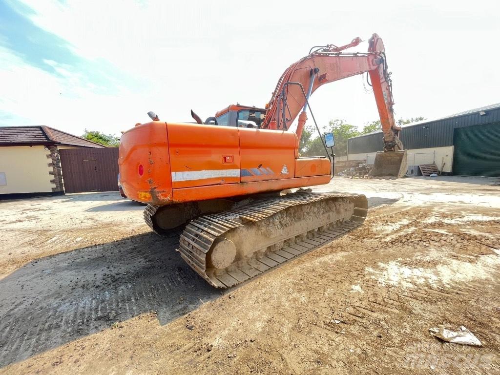 Doosan DX225 Kolesové rýpadlá