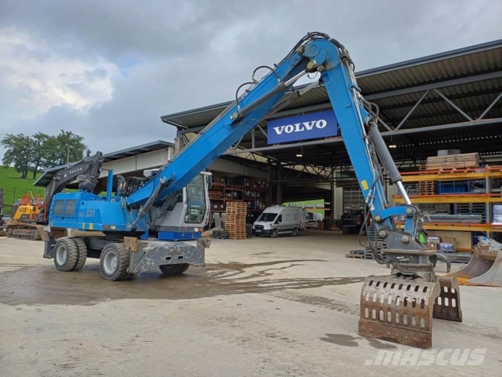 Fuchs MHL 331 Stroje pre manipuláciu s odpadom