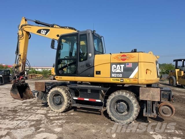CAT M315D Kolesové rýpadlá