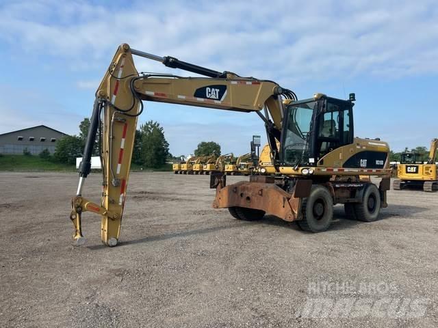 CAT M318D Kolesové rýpadlá