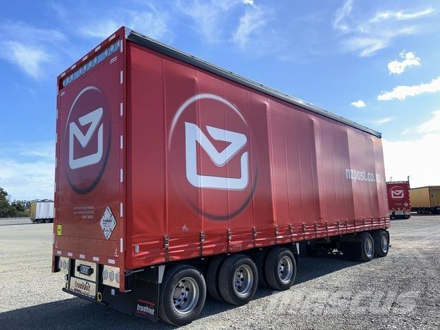 Fruehauf  Prívesy s bočnou zhrnovacou plachtou