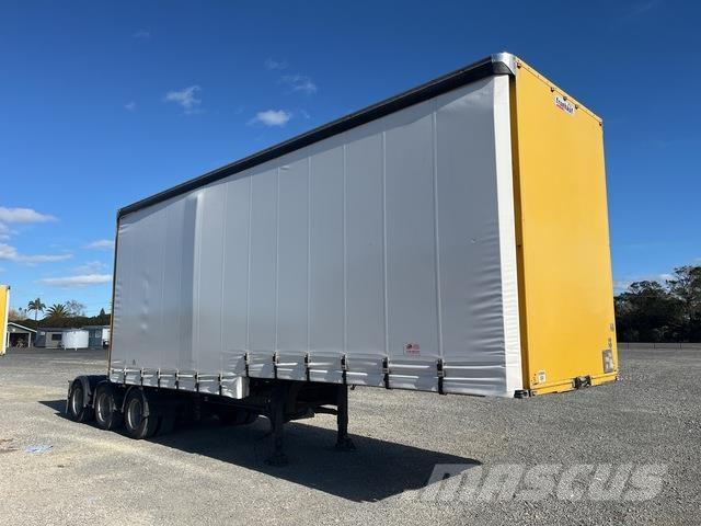 Fruehauf  Prívesy s bočnou zhrnovacou plachtou