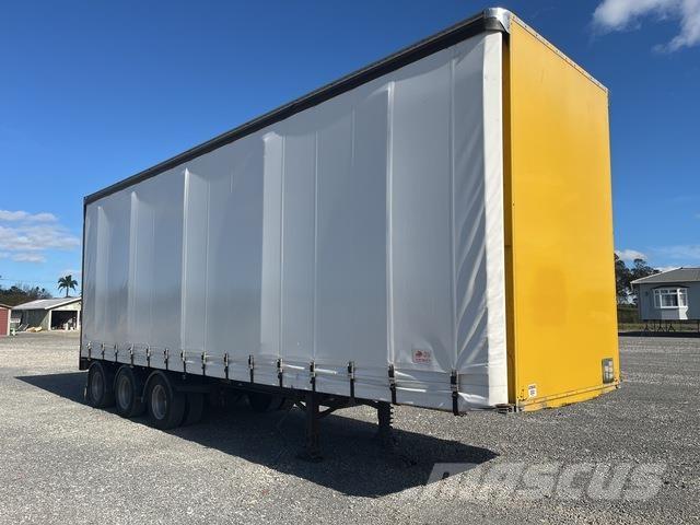 Fruehauf  Prívesy s bočnou zhrnovacou plachtou