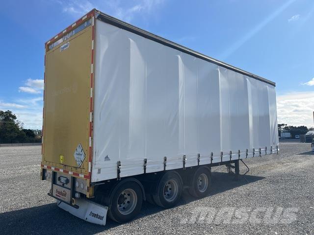 Fruehauf  Prívesy s bočnou zhrnovacou plachtou