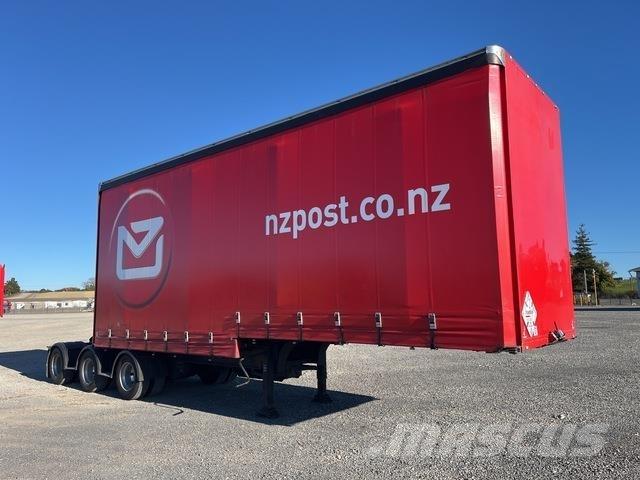 Fruehauf  Prívesy s bočnou zhrnovacou plachtou