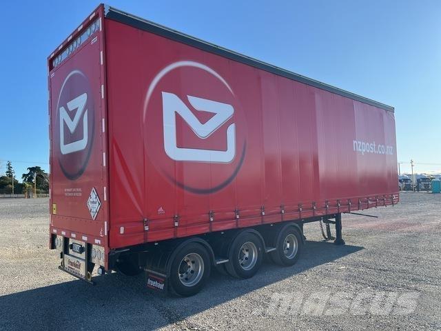 Fruehauf  Prívesy s bočnou zhrnovacou plachtou