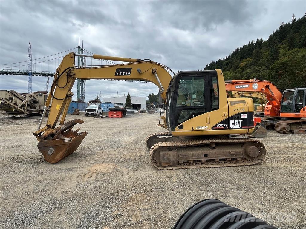 CAT 311C Pásové rýpadlá