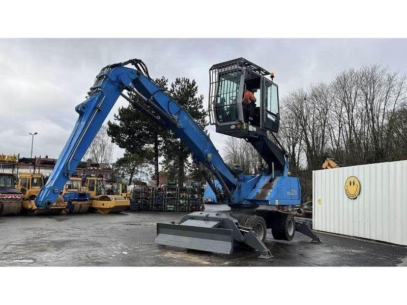 Fuchs MHL320 Stroje pre manipuláciu s odpadom