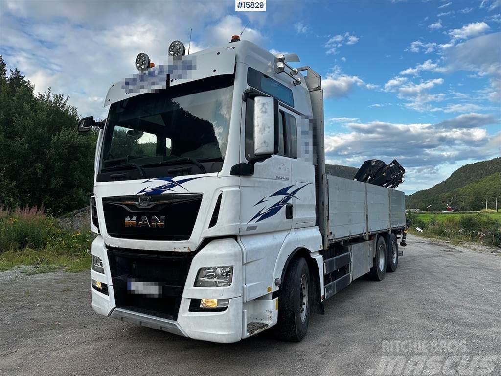 MAN TGX 26.560 Flatbed truck with Hiab 138 crane from  Plošinové nákladné automobily/nákladné automobily so sklápacími bočnicami